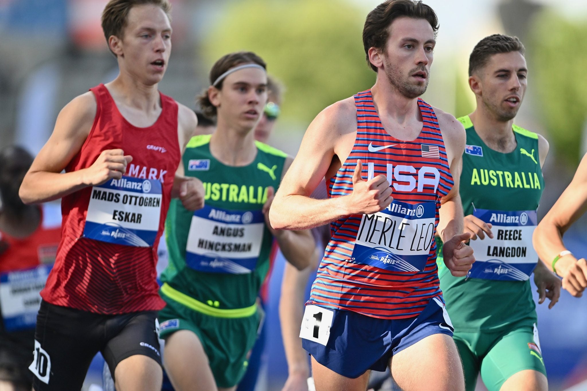 A group of young male runners -- Leo Merle, bearded, in Team USA uniform, second from right
