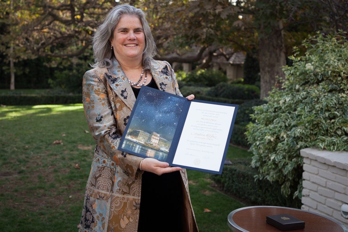 Andrea Ghez holding her Nobel Prize citation