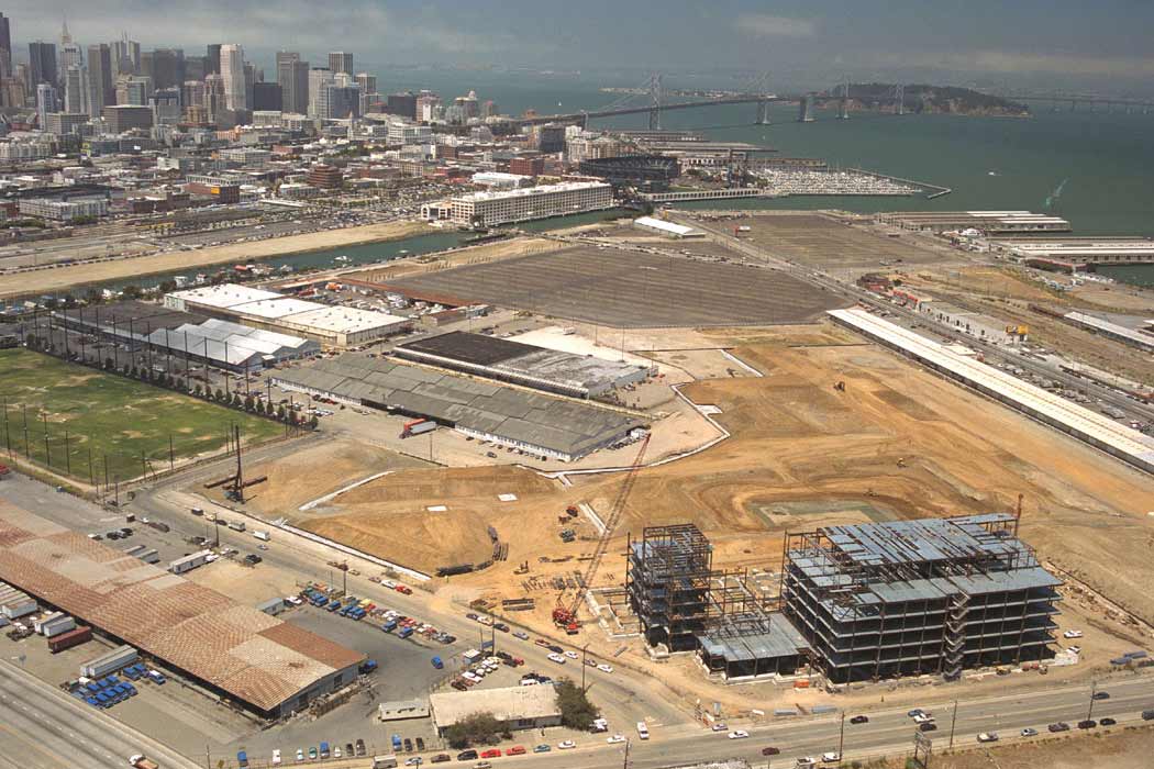 Aerial view of a mostly vacant lot next to the Bay in San Francisco where construction is about to begin