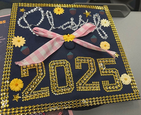 A hand-decorated graduation class bedazzled with the words "Class of 2025"