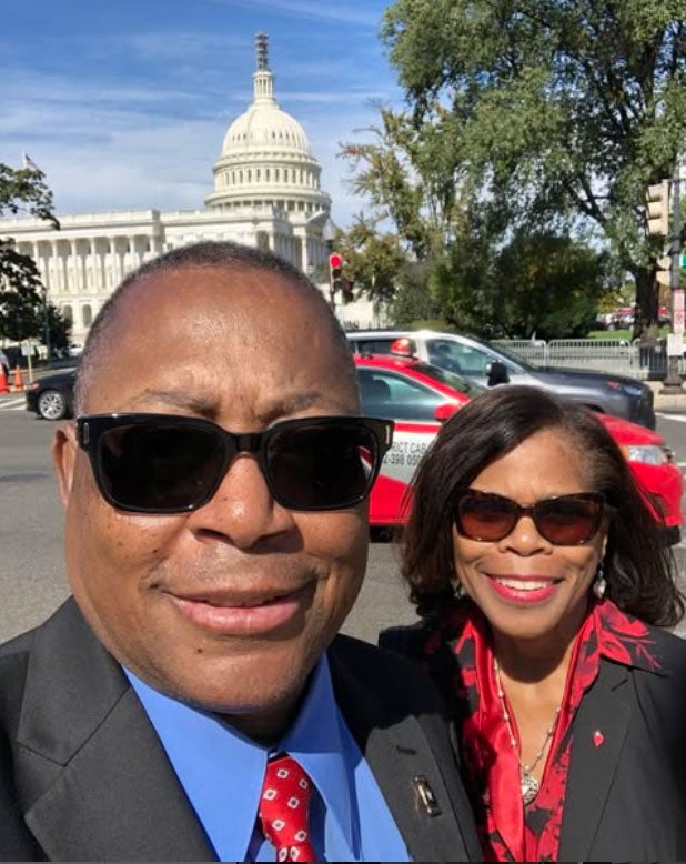 Mel and Cecelia Mann smile for a selfie outside the U.S. Capitol Building