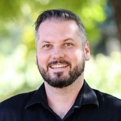 Michael Beyeler smiles for a portrait