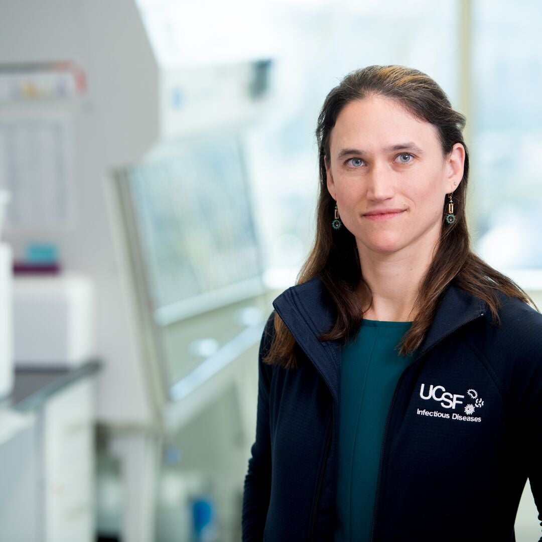 A woman with shoulder-length hair in a blue UCSF fleece