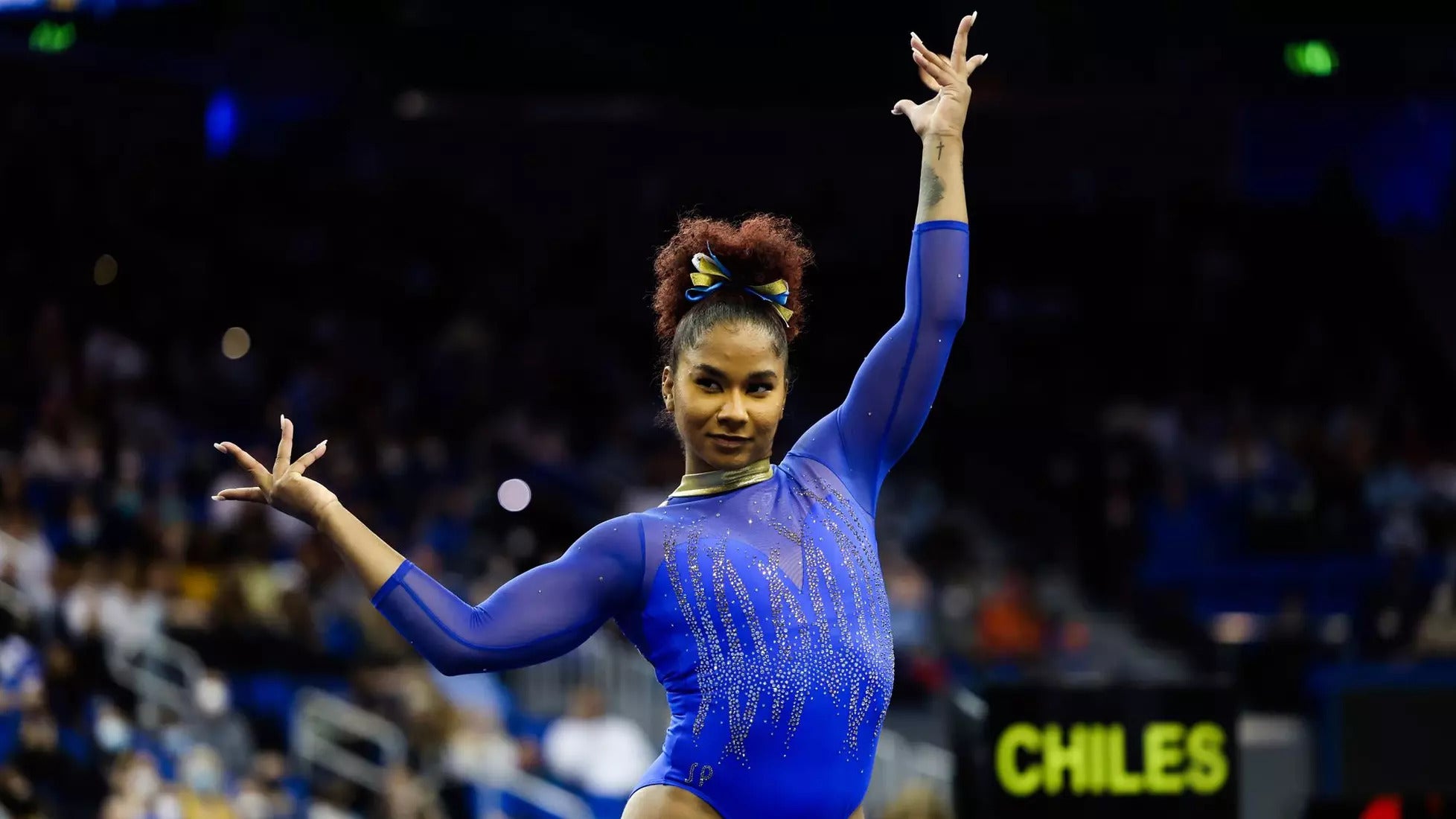 Jordan Chiles poses dramatically in a leotard in competition