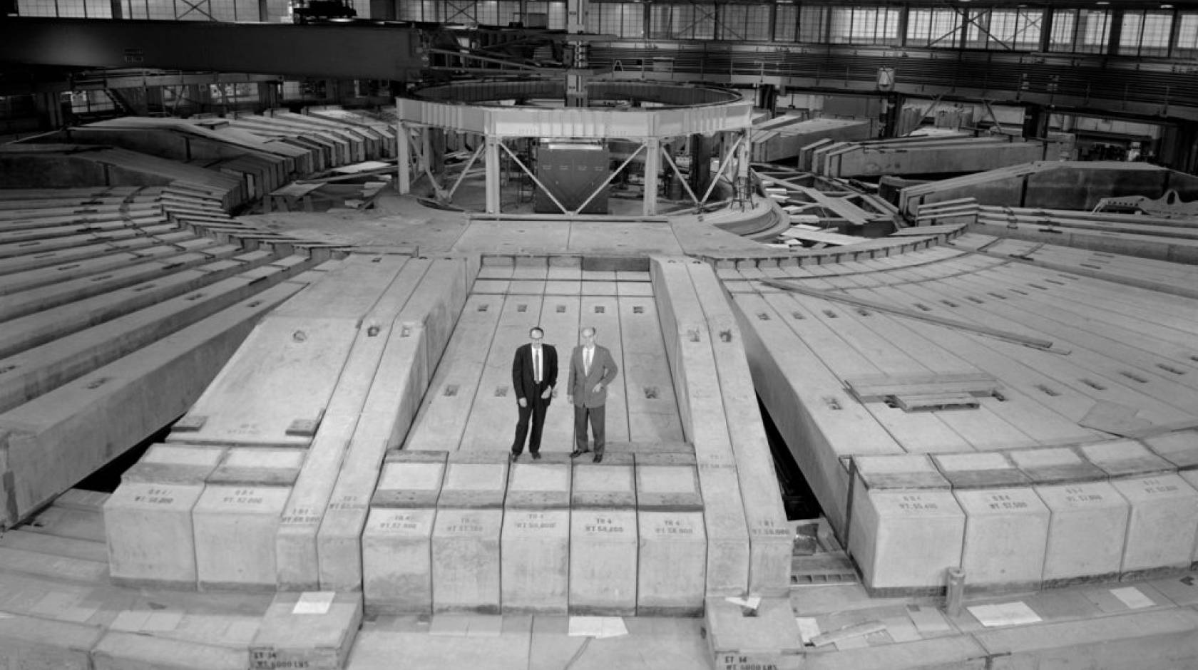 Then-Berkeley Lab Director Edwin McMillan, left, and Bevatron Group Leader Ed Lofgren, stand atop the 7-feet-thick concrete shielding at the remodeled Bevatron in this 1963 photo.