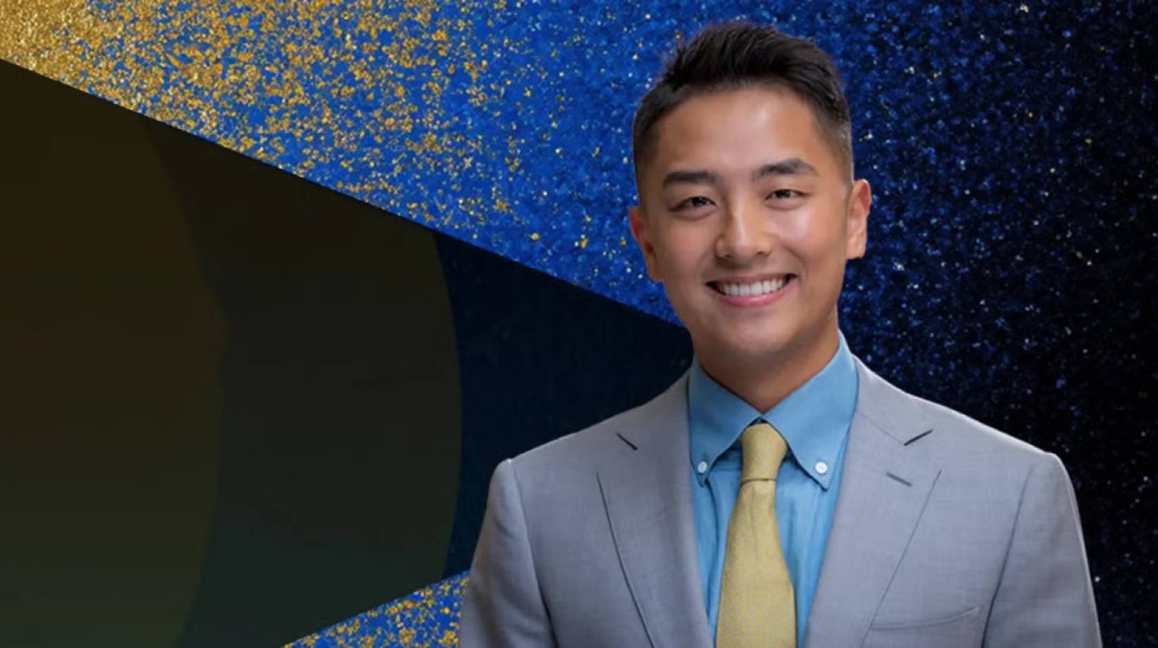 Young man in a suit smiling with John Wooden Leadership Fellows text on the left