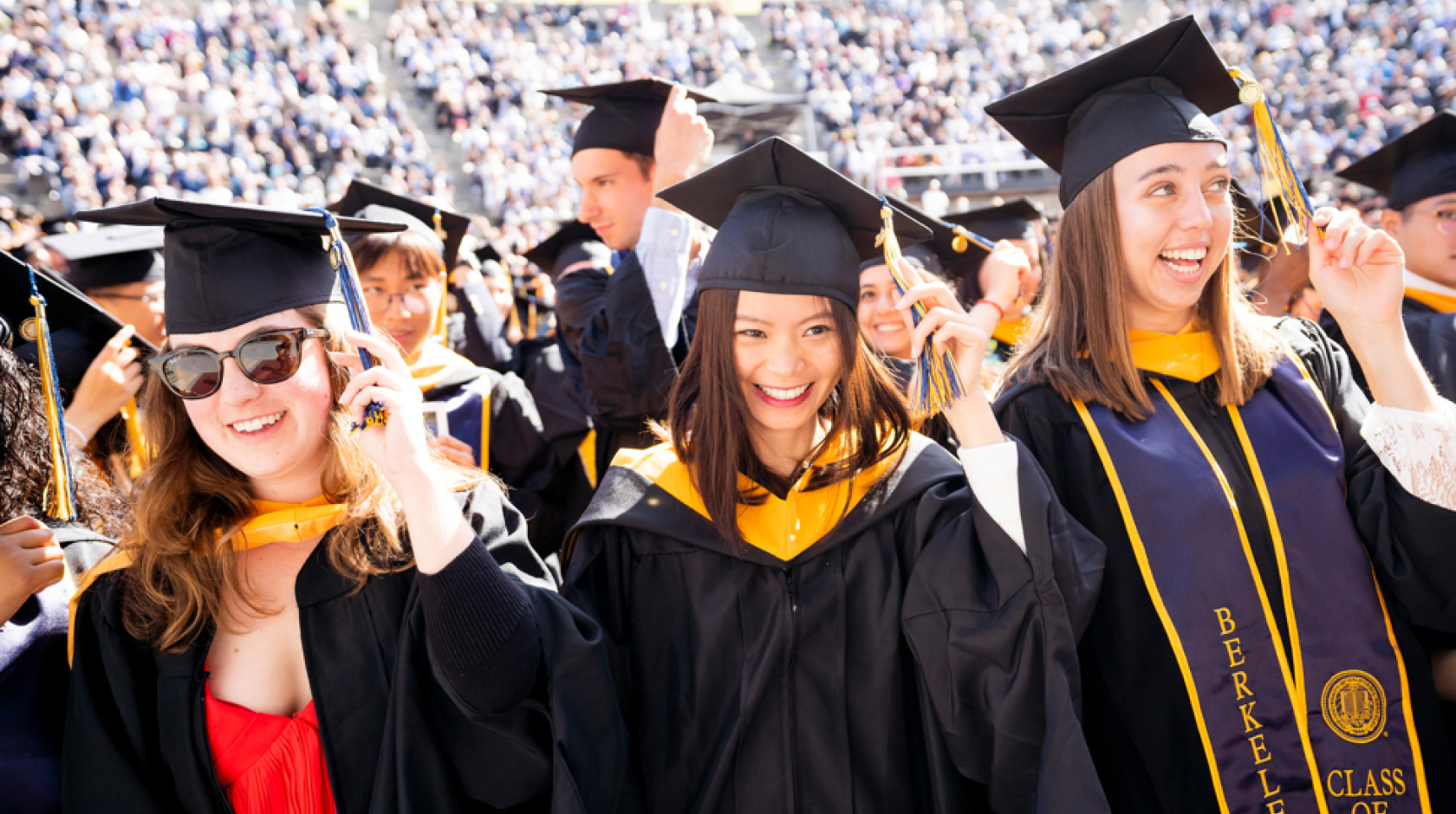 Students at UC Berkeley's 2022 graduation turn their tassels