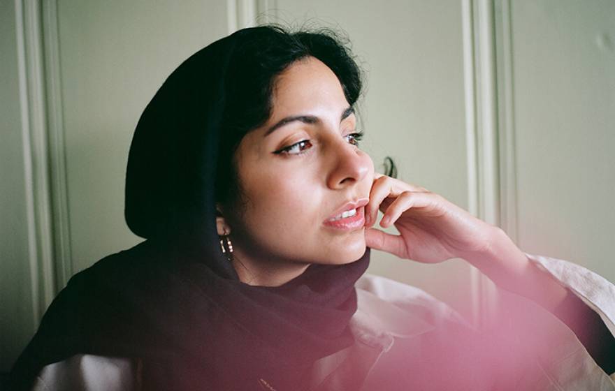 Hoda Katebi looking out a window