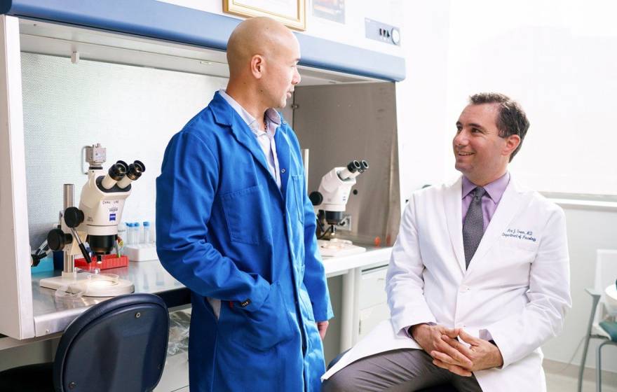 Two doctors talking to each other at UCSF