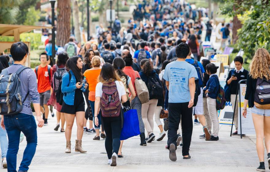 A UC campus outdoor walkway filled with students