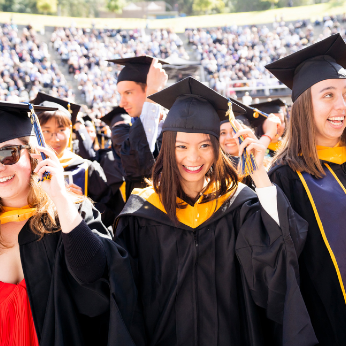 Students at UC Berkeley's 2022 graduation turn their tassels